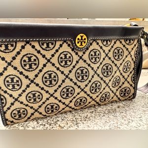 Tory Burch Navy monogrammed wristlet. Gold detailed w/beautiful yellow interior.